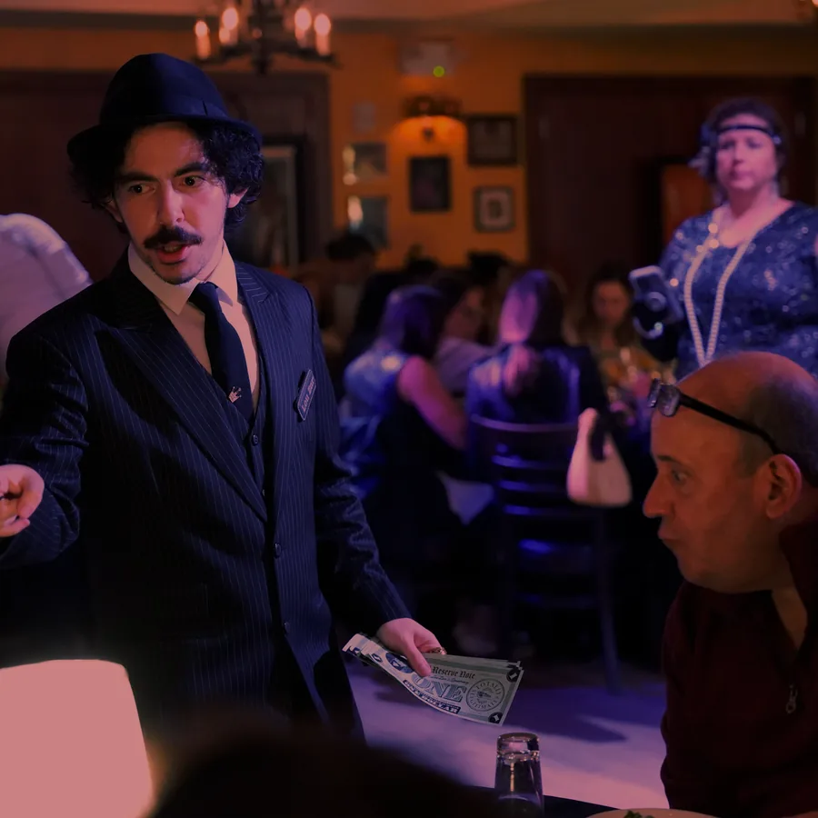 A Murder Mystery Company actor working the room at a Chicago show
