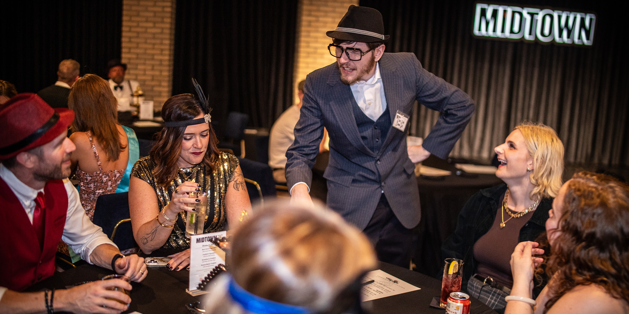 Guests at a Murder Mystery Company public dinner show in Chicago